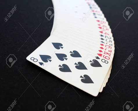 76319994-the-combination-of-playing-cards-poker-casino-isolated-on-black-background-poker-table